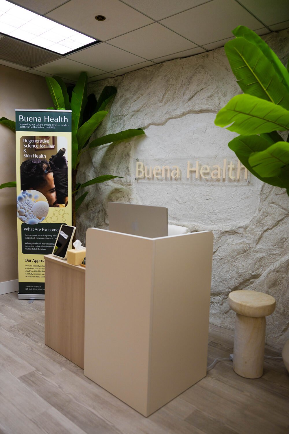 The Buena Health reception with the signature wall sign